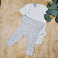 Haut Onesies, bas Tag NB
